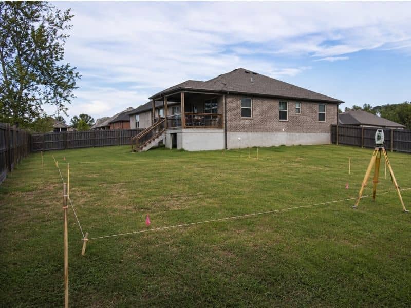 lot survey clarksville tn backyard garage - Clarksville Land Surveying Lot Survey for backyard garage placement with property stakes in Clarksville Tennessee